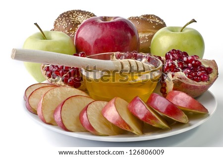 Still life - challah, apples, pomegranate and bowl of honey over white. Illustration of Rosh Hashanah (jewish new year) or Savior of the Apple Feast Day