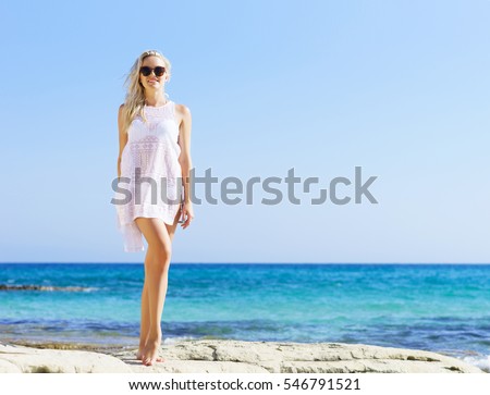 https://thumb7.shutterstock.com/display_pic_with_logo/84070/546791521/stock-photo-beautiful-fit-and-sexy-girl-in-white-bikini-posing-on-a-beach-at-summer-sea-and-sky-background-546791521.jpg