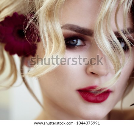 https://thumb7.shutterstock.com/display_pic_with_logo/840886/1044375991/stock-photo-beautiful-blonde-model-girl-with-long-curly-hair-hairstyle-wavy-curls-and-red-lips-fashion-1044375991.jpg