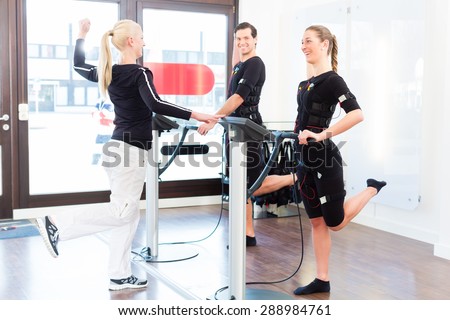 http://thumb7.shutterstock.com/display_pic_with_logo/84610/288984761/stock-photo-female-coach-giving-man-and-woman-ems-electro-muscular-stimulation-exercise-288984761.jpg