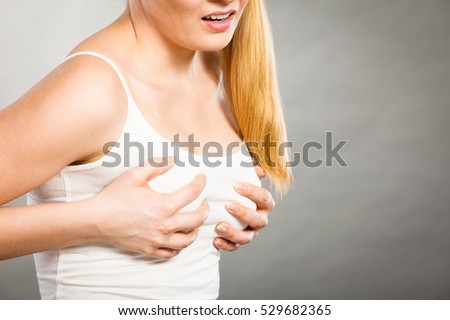 breast touching chest pain young woman menstrual cyclic problem feel gray concept health her shutterstock
