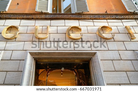 Rome, Italy - October 14, 2016: Gucci Sign on street shop window in Rome, Italy.