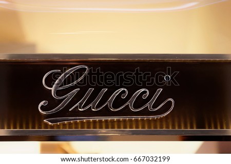 Rome, Italy - October 14, 2016: Gucci Sign on street shop window of Rome, Italy.