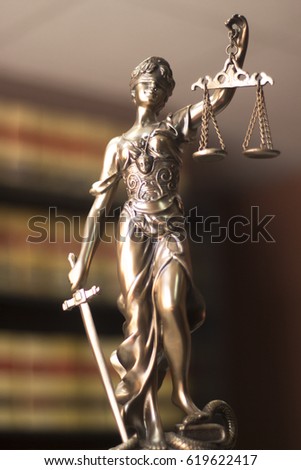 Law offices of lawyers legal statue Greek blind goddess Themis bronze metal statuette figurine with scales of justice.