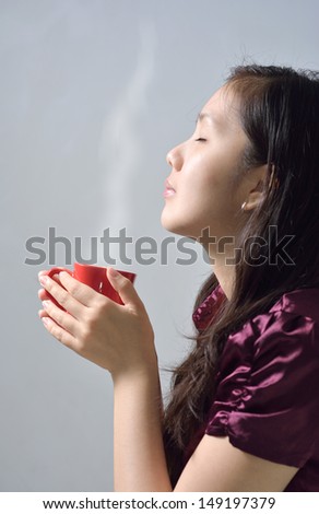 https://thumb7.shutterstock.com/display_pic_with_logo/862606/149197379/stock-photo-beautiful-woman-drinking-coffee-asian-enjoy-cup-of-hot-chocolate-portrait-of-female-with-morning-149197379.jpg