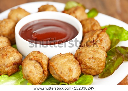 Meatball appetizers with a dipping sauce - stock photo