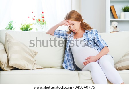 pregnant woman with a headache and pain