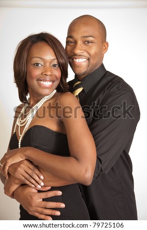 https://thumb7.shutterstock.com/display_pic_with_logo/87914/87914,1308617038,69/stock-photo-happy-romantic-black-couple-hugging-and-smiling-with-affection-and-pleasure-79725106.jpg