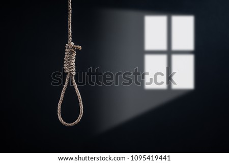 the noose with windows light against the glum background, homicide or commit suicide concept