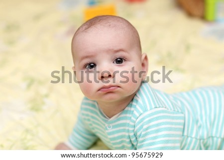 stock-photo-portrait-of-sad-baby-boy-at-home-95675929.jpg