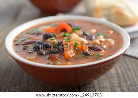 Three bean soup on a rustic table