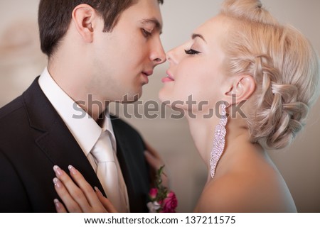 http://thumb7.shutterstock.com/display_pic_with_logo/913579/137211575/stock-photo-wedding-bride-and-groom-happy-loving-couple-with-roses-bouquet-flowers-at-bridal-day-enjoy-moment-137211575.jpg
