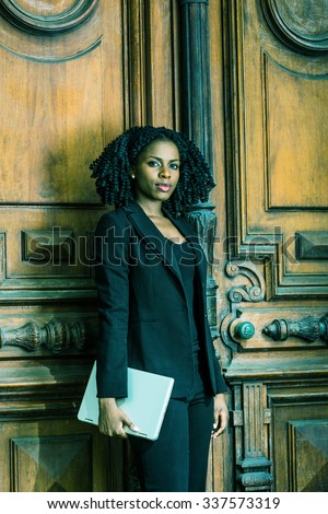 https://thumb7.shutterstock.com/display_pic_with_logo/917021/337573319/stock-photo-color-c-ac-filtered-look-african-american-business-woman-working-in-new-york-holding-laptop-337573319.jpg