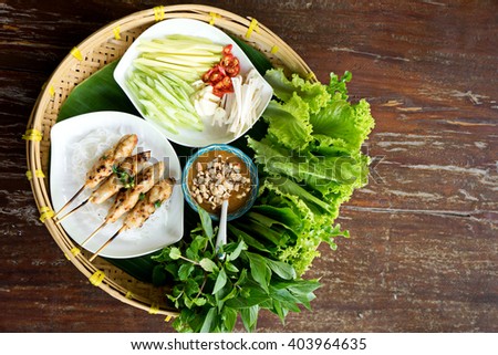 due Nham vietnam food more vegetable and grilled pork on wood table