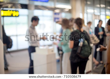 Blur people in line for hand check ticket before go to airplan in airport station terminal