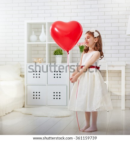 Happy Valentine's Day! Sweet child girl with red heart.