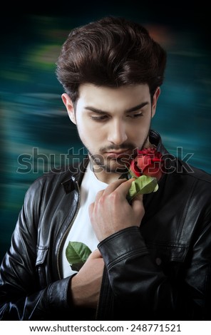 https://thumb7.shutterstock.com/display_pic_with_logo/919469/248771521/stock-photo-handsome-man-with-a-single-red-rose-248771521.jpg