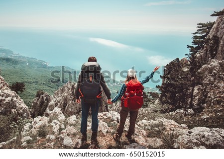 https://thumb7.shutterstock.com/display_pic_with_logo/919514/650152015/stock-photo-happy-couple-man-and-woman-holding-hands-enjoying-mountains-aerial-view-love-and-travel-emotions-650152015.jpg
