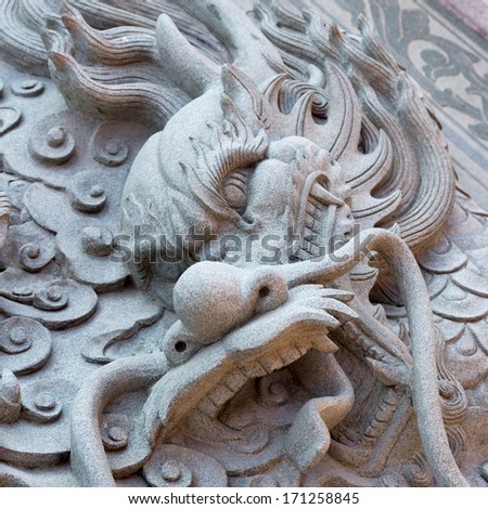 Dragon carved from stone - stock photo