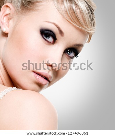 https://thumb7.shutterstock.com/display_pic_with_logo/93178/127496861/stock-photo-beautiful-woman-with-style-eye-makeup-closeup-face-of-fashion-model-127496861.jpg