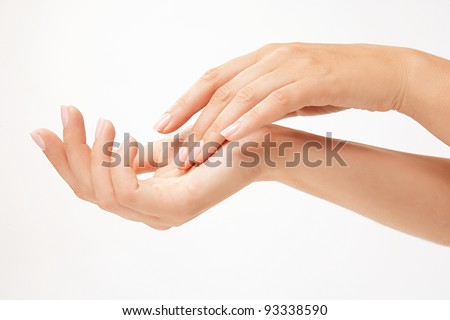 Beautiful woman's hands on the white background