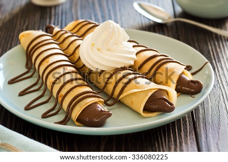 Jeudi 2 février Stock-photo--three-chocolate-hazelnut-spread-nutella-crepes-with-whipped-cream-336080225
