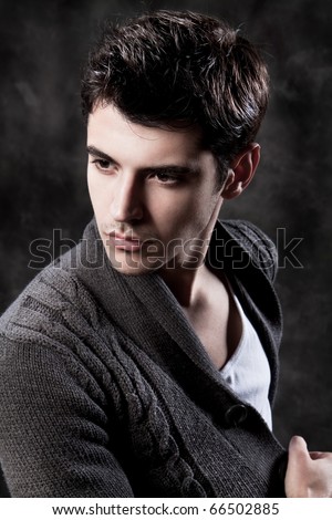 Fashion Shot of a macho Man. A trendy European man dressed in contemporary cloth. He is now a professional model.
