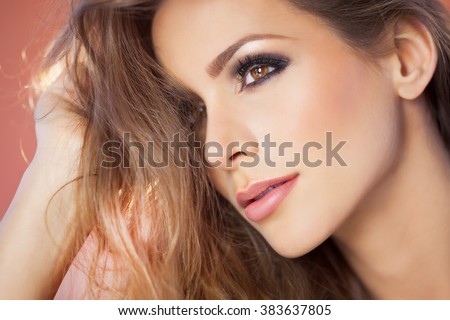 https://thumb7.shutterstock.com/display_pic_with_logo/9437/383637805/stock-photo-beautiful-young-dreamy-woman-portrait-with-smoky-eyes-makeup-and-long-hair-383637805.jpg