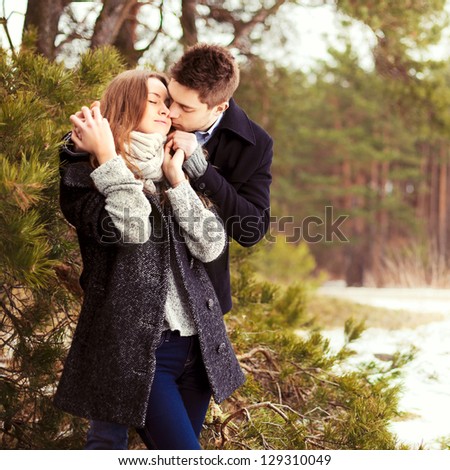 https://thumb7.shutterstock.com/display_pic_with_logo/952708/129310049/stock-photo-happy-young-couple-in-winter-park-having-fun-family-outdoors-love-129310049.jpg