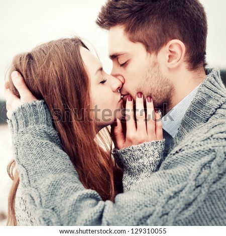 Zaljubljeni par - Page 11 Stock-photo-happy-young-couple-in-winter-park-having-fun-family-outdoors-love-kiss-129310055