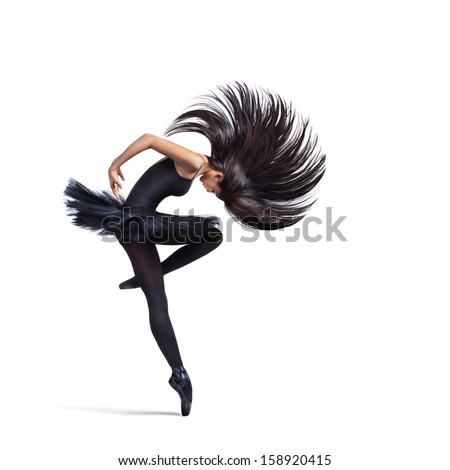 young beautiful dancer posing on a studio background