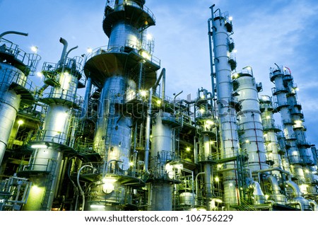 Column tower in petrochemical plant at twilight
