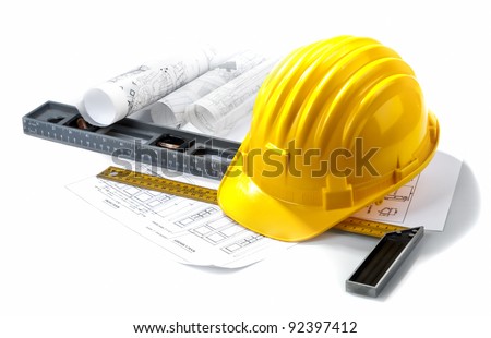 isolated hard hat with blueprints and rulers on white - stock photo