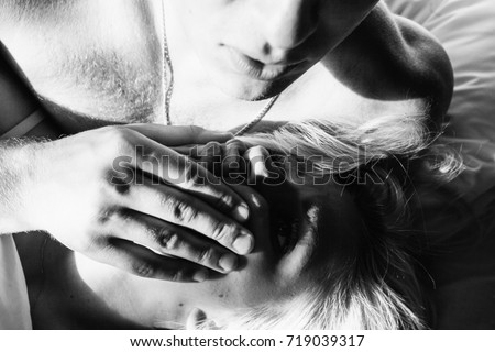 Young romantic couple in love have fun and hugs in the white bed love and Young romantic couple in love have fun and hugs in the white bed love and
