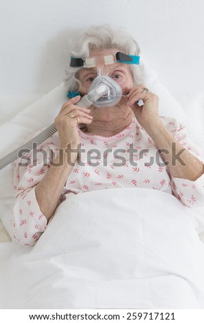 stock-photo-elderly-woman-adjusting-her-cpap-machine-259717121.jpg