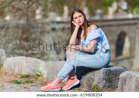 girl wearing ripped jeans