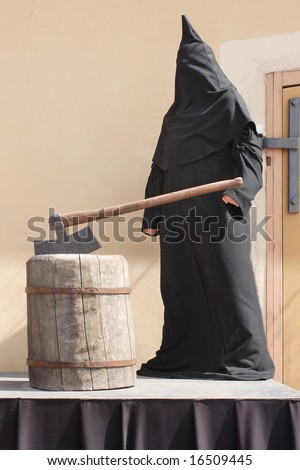 Executioner on a scaffold. Waxen figure - stock photo