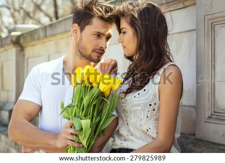 https://thumb7.shutterstock.com/display_pic_with_logo/999518/279825989/stock-photo-man-giving-flowers-woman-279825989.jpg