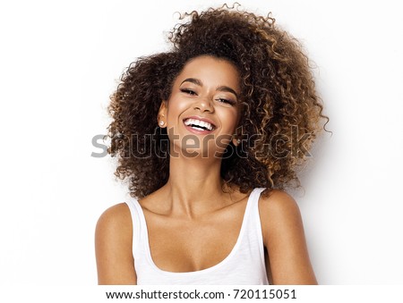 Beautiful african american girl with an afro hairstyle smiling
