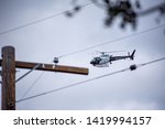 Small photo of Northridge, CA / United States - May 27, 2019: LAPD Air Unit and Patrol Units respond to brandishing/ADW call in suburban neighborhood.