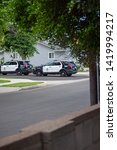 Small photo of Northridge, CA / United States - May 27, 2019: LAPD Patrol Units respond to brandishing/ADW call in suburban neighborhood with mulitple police cars. Three LAPD cars are seen here.