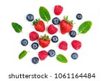 Fresh berries isolated on white background, top view. Strawberry, Raspberry, Blueberry and Mint leaf, flat lay