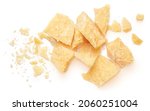 Small photo of Pieces of parmesan cheese isolated on white background. Parmesan chunks with crumbs top view