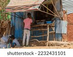 Small photo of DEBARK, ETHIOPIA - JANUARY 2018: Man at a small shop in Debark.