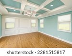 Beautiful Light Blue Custom Master Bedroom Complete with Entire Wainscoting Wall, Fresh Paint, Crown and Base Molding, Hard Wood Floors and Coffered Ceiling
