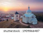 Mikulov and Svaty kopecek during sunset from above. Famous tourist destination in south moravia. Evening town panorama with castle.