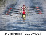 Rowers in eight-oar rowing boats on the tranquil lake
