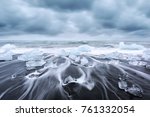 Picturesque landscape with iceberg pieces on Diamond beach near Jokulsarlon lagoon, Iceland. Atlantic Ocean view