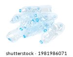 Heap of crumpled empty plastic water bottles isolated on white background