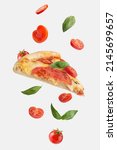 Small photo of flying slice of margherita pizza with tomatoes and basil